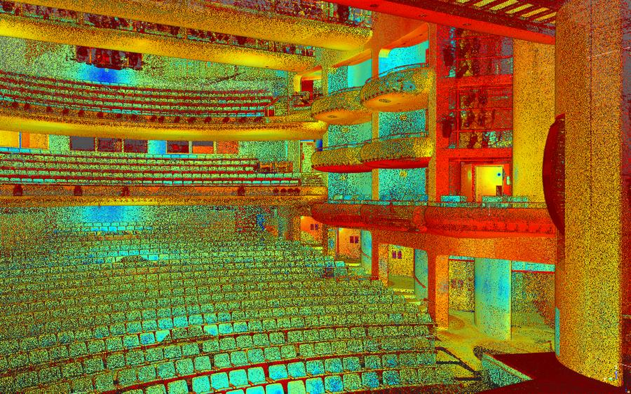 Intensity-coloured LiDAR point cloud of a theatre auditorium seen from the stage — seating tiers, stacked balconies, a structural column and doorways.